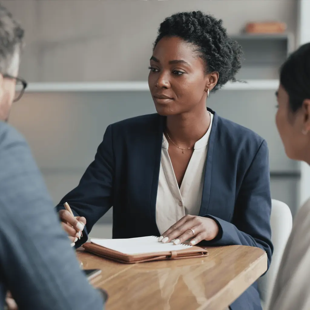 Amara Okafor meeting with colleagues